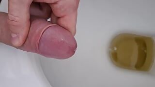 Jerking off, pissing and cumming all in one