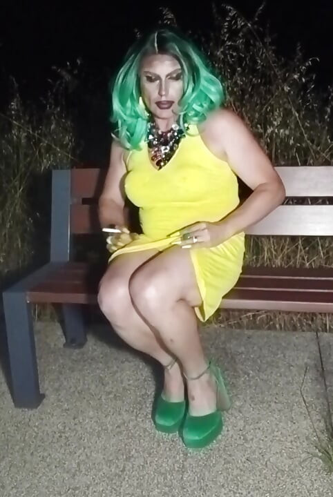 Sexy mature transvestite slut party summer showing off in a public park