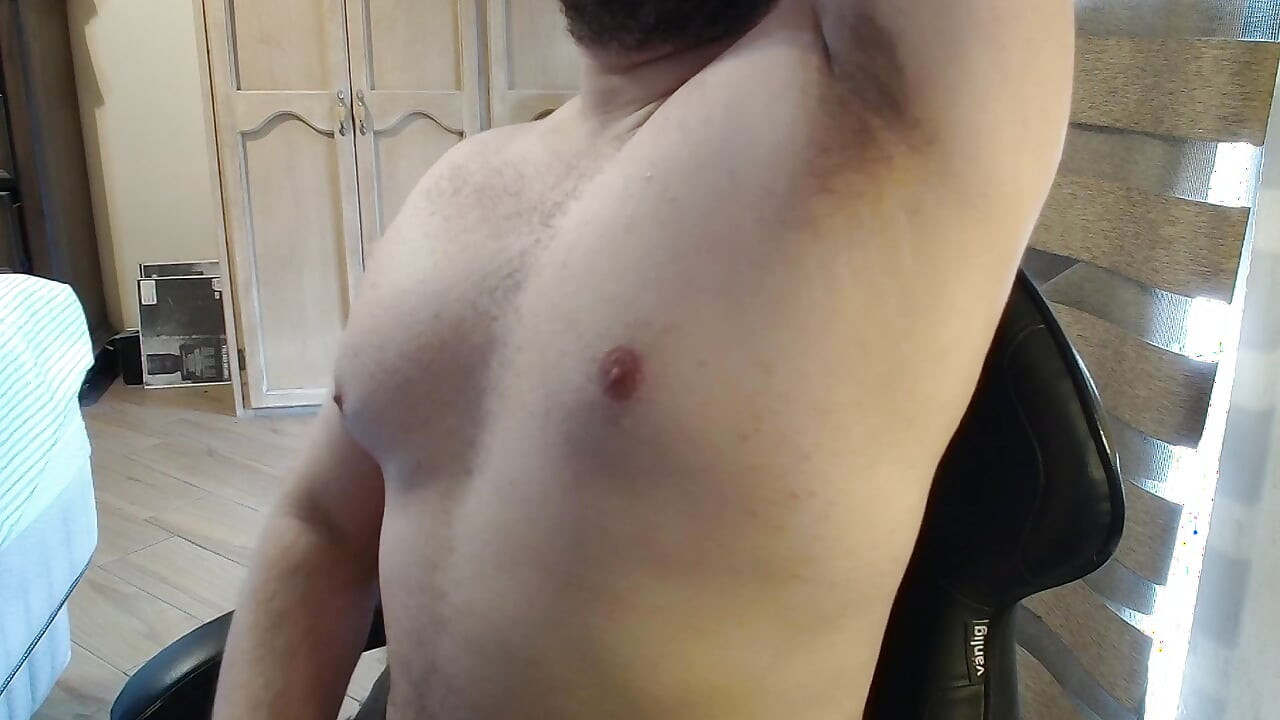 Beefy jock dances and flexes in a thong