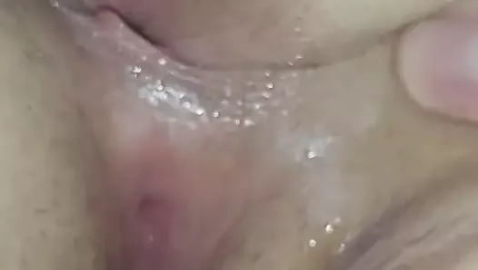 Spreading her creamy arse cheeks & pussy lips