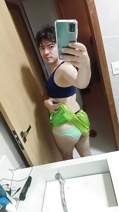 gay femboy sexy skirt lingerie and licking lollipop
