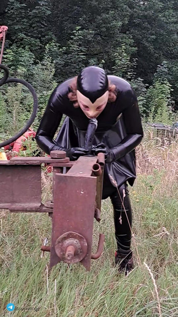 Latex Sissy Sucks A Dildo In The Wild