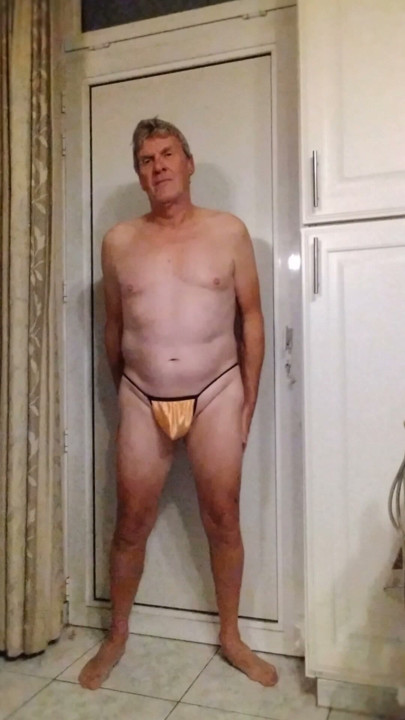 I show myself in a tiny yellow thong.
