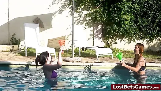 A strip down game outdoors in the swimming pool