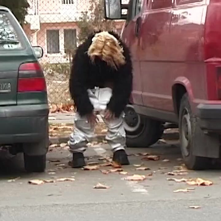 Girl peeing between the cars