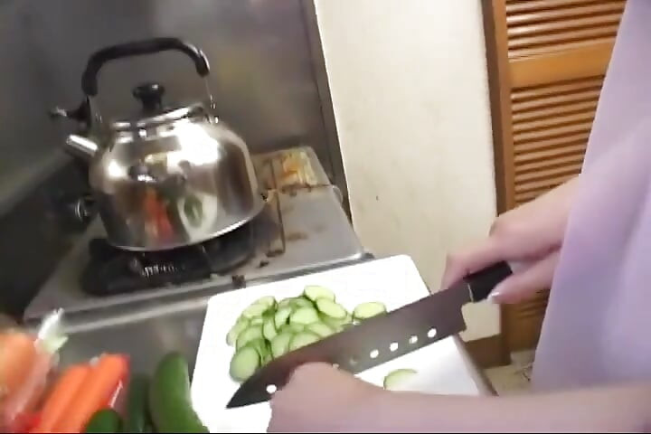 Insatiable Young Wife Drenches Cucumber Deep in Kitchen Sink