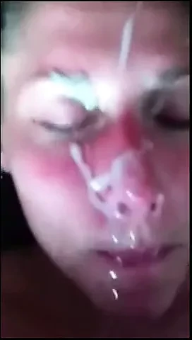 He masturbates on her pretty face