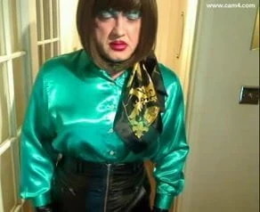 Candi Smokes in gren satin blouse and leather skirt