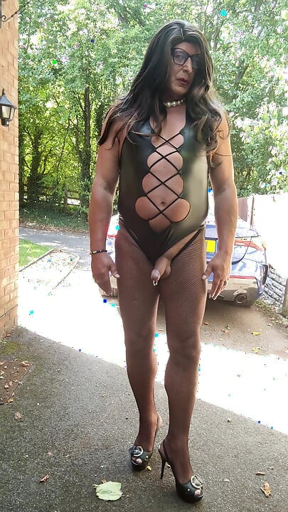 Sexy Crossdresser Kellycd2022's in black pvc bodysuit and fishnet pantyhose