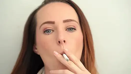 Extreme Close up Blue Eyed Redhead Smoking