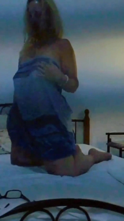 Selena's bed pleasure in a dusk