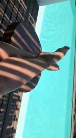 Aryana's hot feet get in the pool