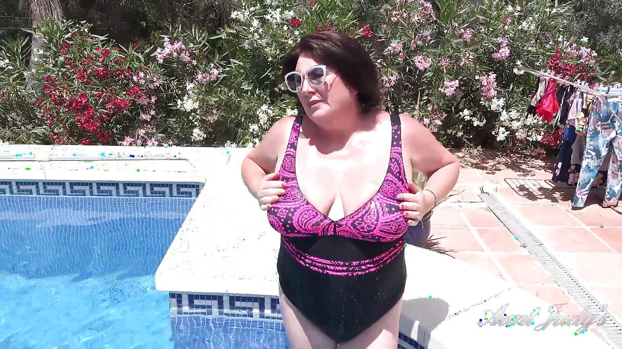Busty Redhead MILF JoJo Robinson Goes Skinny Dipping in the Pool