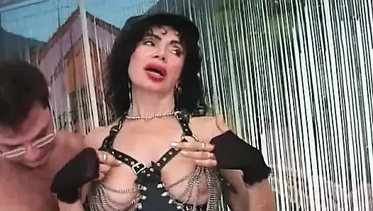 Horny MILF in Leather Harness Devours Throbbing Cocks