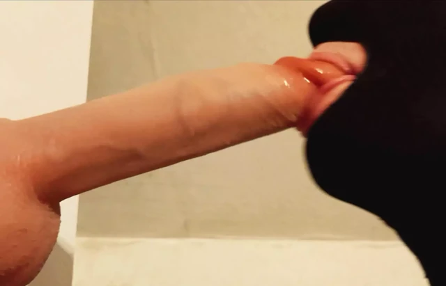 Sissy sucks two dildos