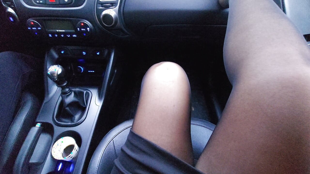 Elegant mature milf in a skirt and stockings teases her driver in the car in the morning with her sexy legs