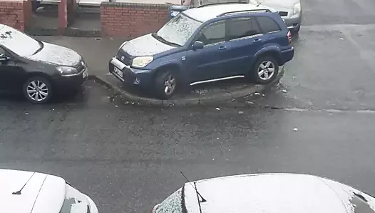 Naked girl has sex in the snow behind the car