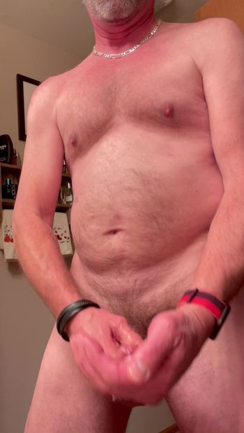 Gay daddy, naked and horny, big cock in his hand, stroking needing  to come, shoots streams of white rope, sperm.