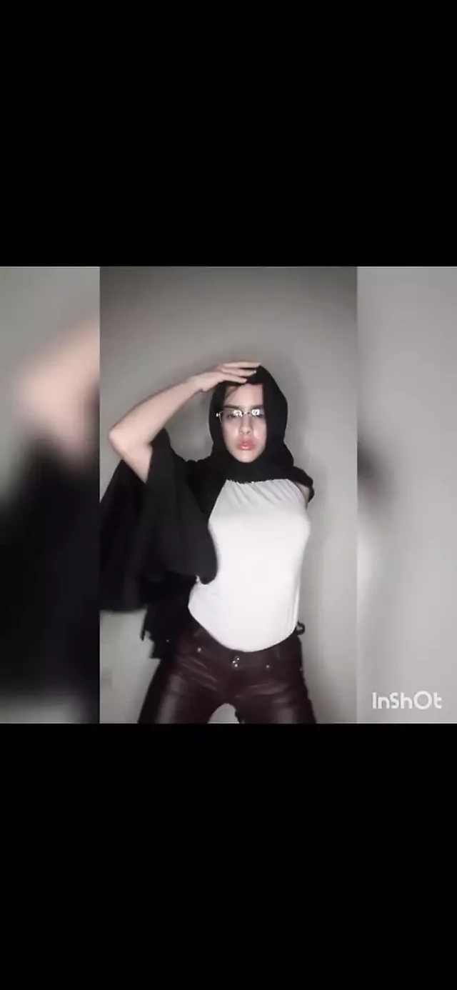 Arab using an exhibitionist wearing thongs and opening the year in front of the window for her neighbors.