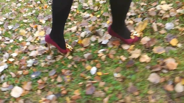 Lady L walking with red high heels.