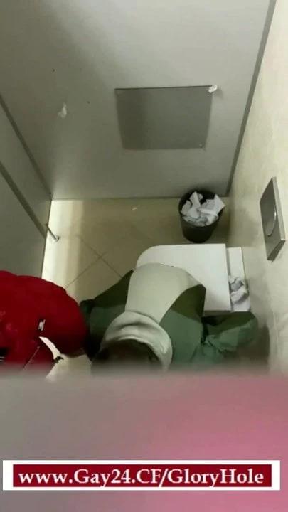 Twink sucking dick through GloryHole