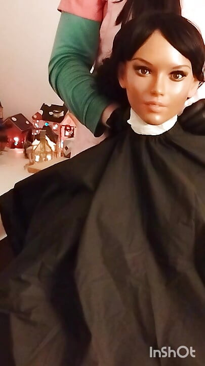 Ebony sex doll Nikki wears barberette capes