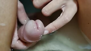 Hot girl plays with her penis in the bathtub, inserts her finger into the urethra
