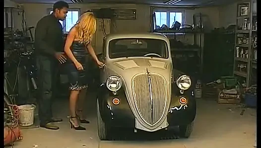 Blonde whore gets fucked by a black cock on the hood of the car