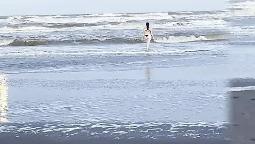 My neighbor loses her clothes at the beach.