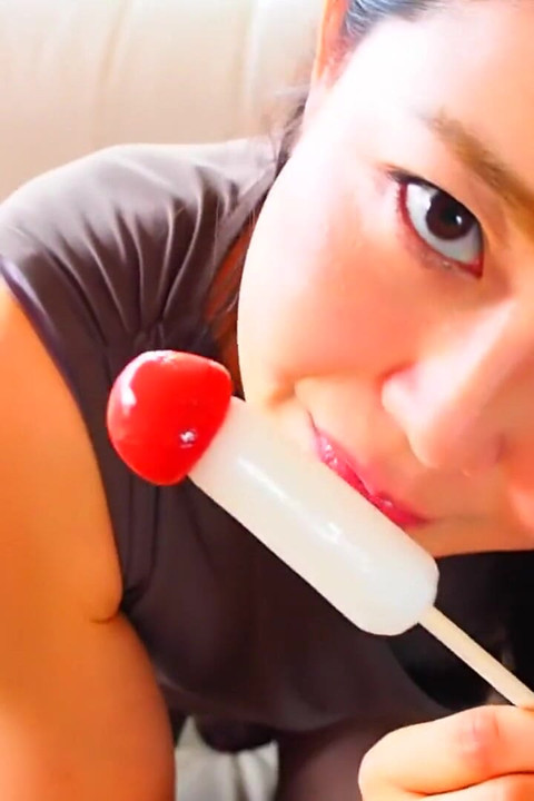 Horny Asian MILF sucking on candy dick