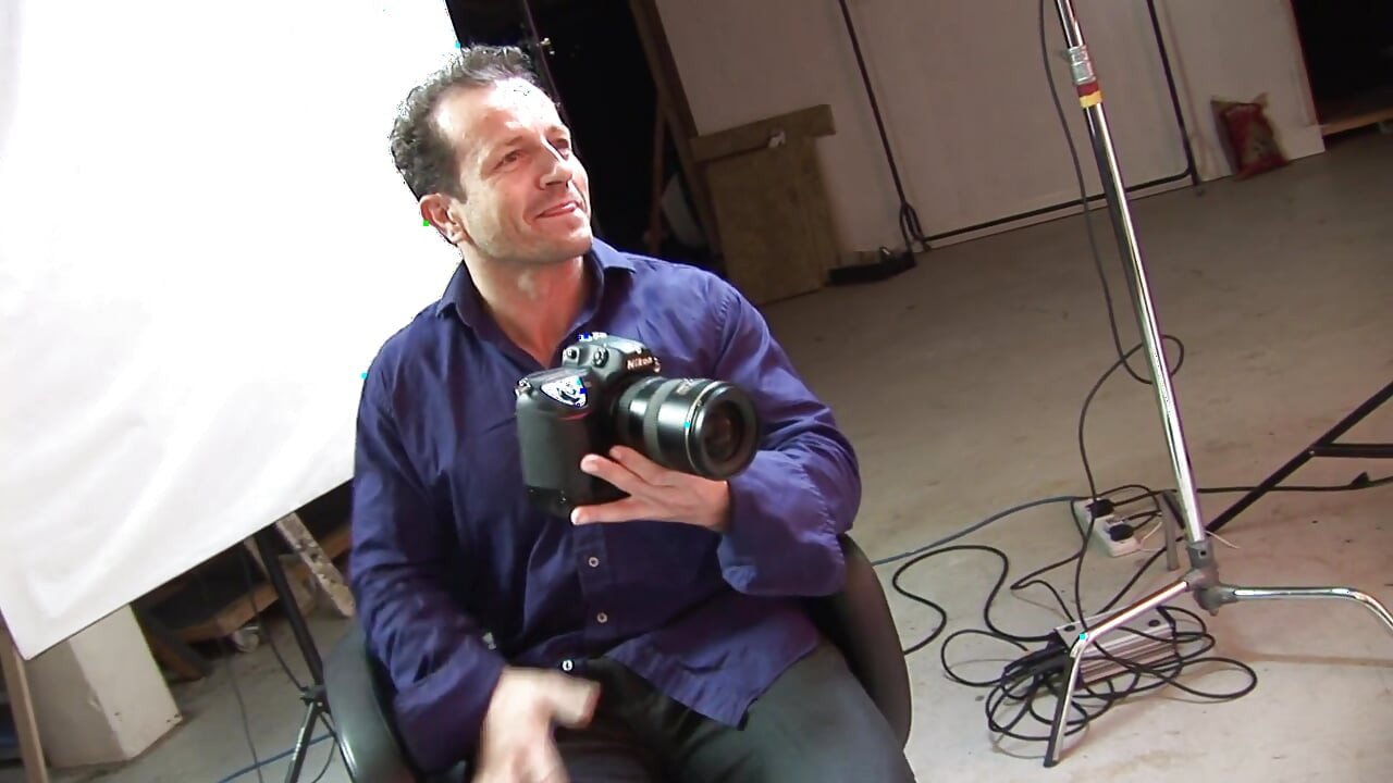 Two horny guys bang two gorgeous girls at a photographer's studio