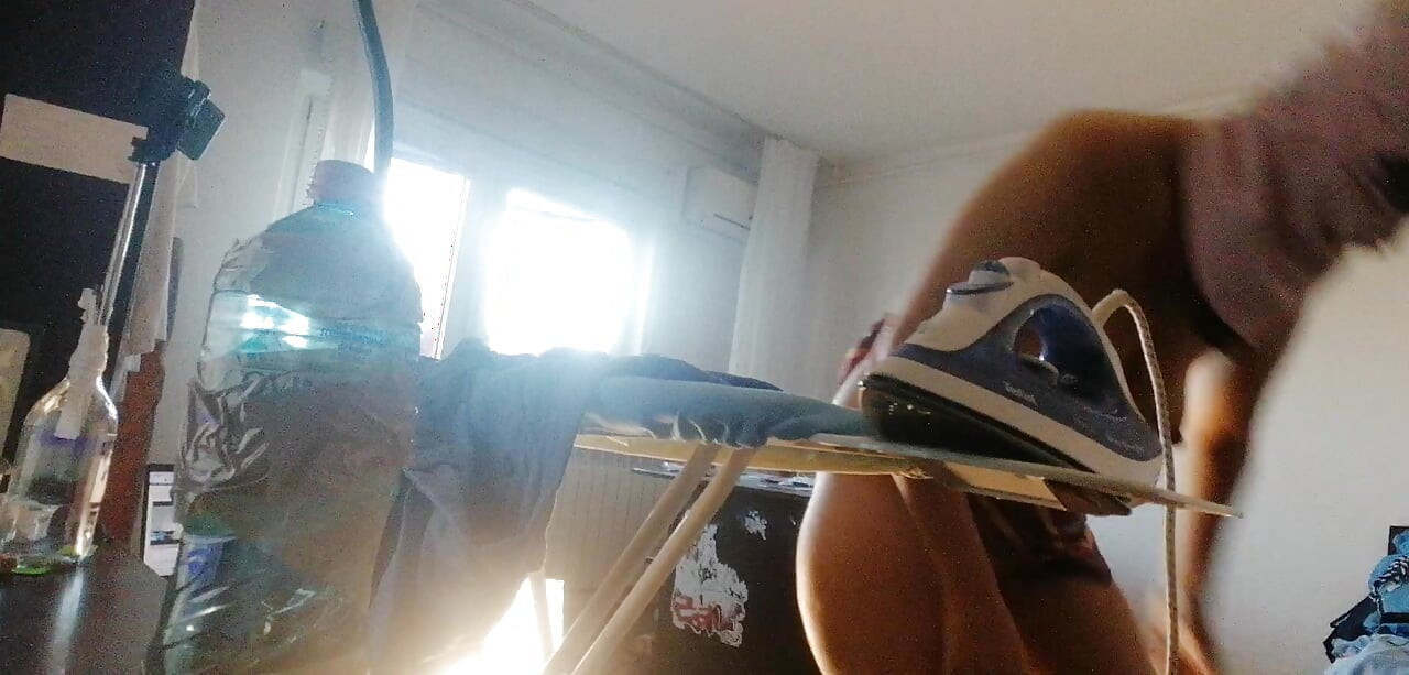 Amateur wife doing housework naked. Sexy and naughty wife trying on clothes that she cuts.
