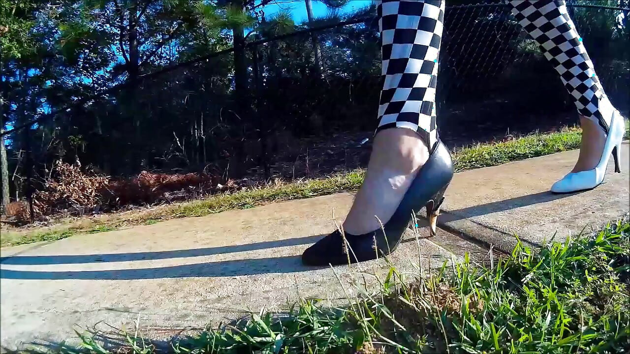Crossdresser Walking in a public park in high heels