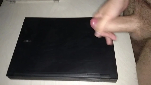 Huge cumshot on colleague laptop in the office