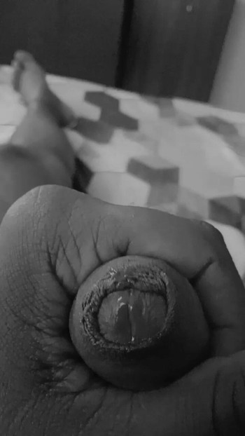 Playing with clean shaven cock and balls