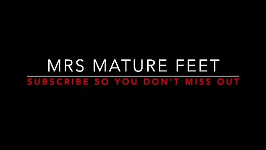 Mrs Mature Feet putting on her Red Sexy Hold Up's 405