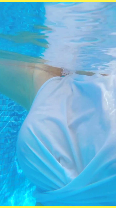 Wifey goes for a swim in a white shirt braless which shows her perfect tits in the water | Clip 1