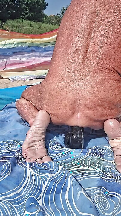 Early morning at the beach stretching of my asshole with my huge black dildo