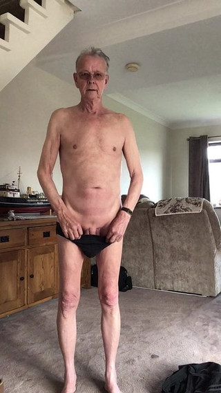 Old man strips naked