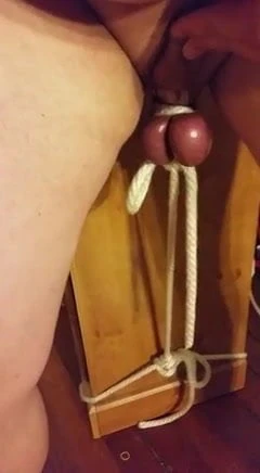 Testicle weight lifting