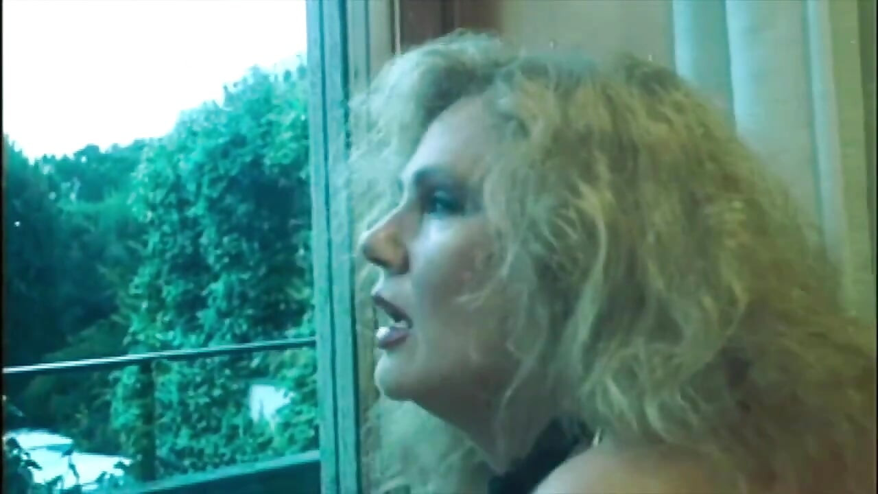 Marina Lotar in 2 Vintage Scenes: a Threesome and Doggy Style with Roberto Malone.