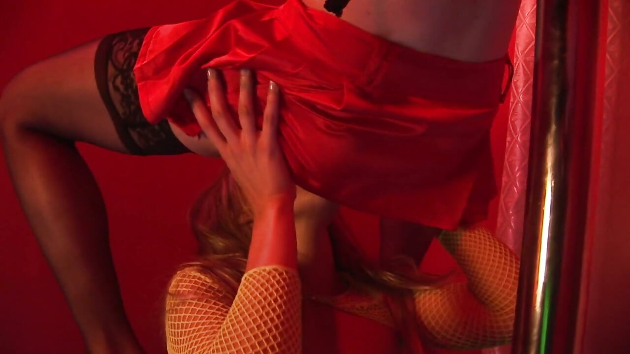 Curly haired babe gives pleasure and takes in a red room