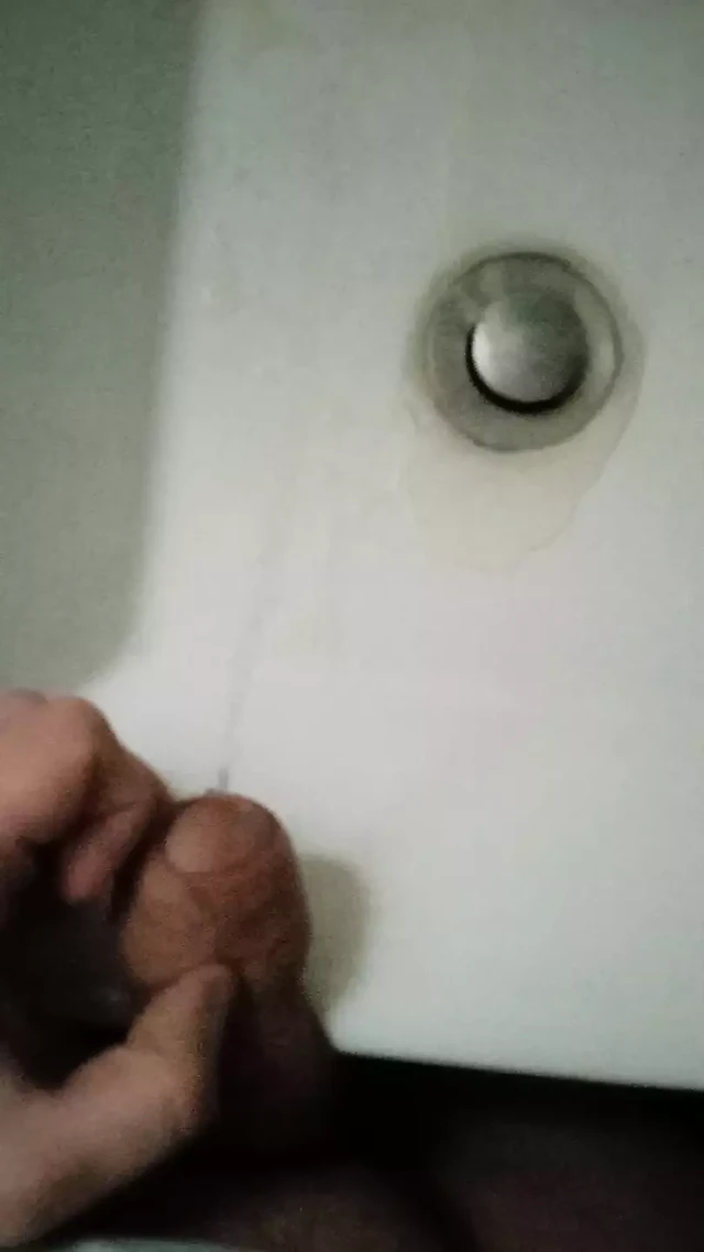 College: Student with a big fat cock pissing in the sink in a public toilet