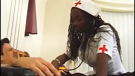 Hot black nurse in stockings gets pounded and creamed by a white dude in bed