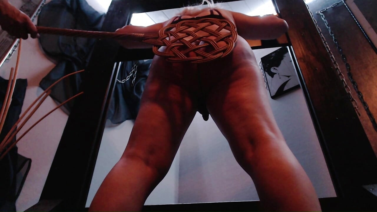 Spanking with carpet beater and cane