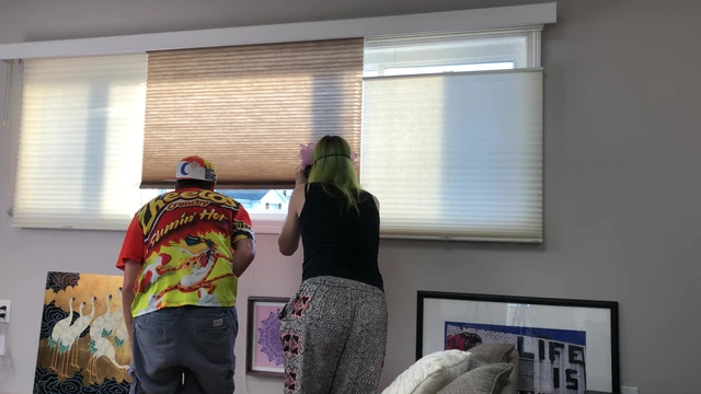 Couple Peeping Outside Apartment Window