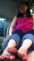 Asian amateur gives her 1st footjob