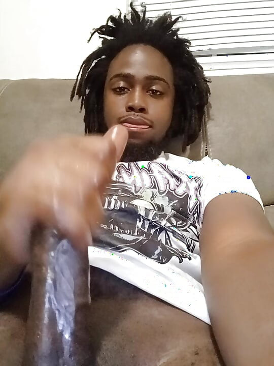 Handsome black man stroking his big dick