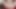 Kızıl saçlı porno izlerken dildoyla mastürbasyon yapıyor