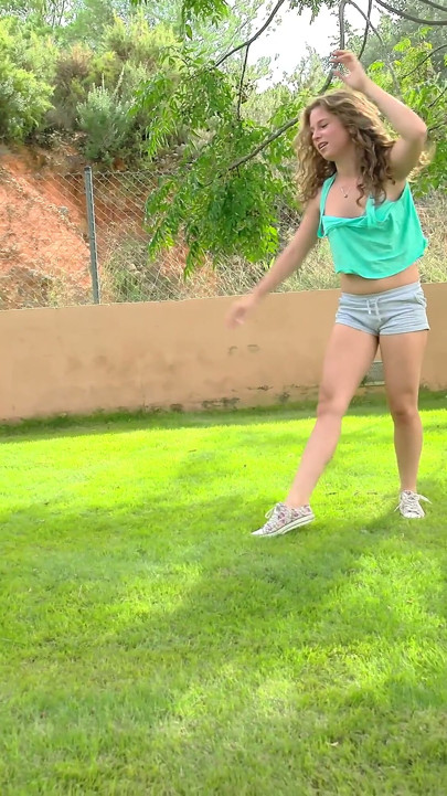Pretty brunette teen masturbating in the backyard